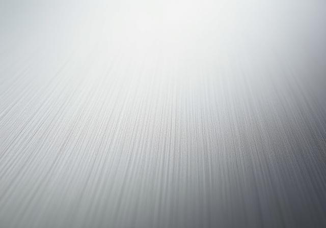 Närbild på borstat syrafast rostfritt stål, material till utekök.